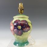 A Moorcroft 'Hibiscus' pattern Lamp Base, tubelined decoration on green ground, factory marks to
