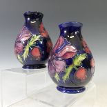 A pair of Moorcroft 'Anenome' pattern Vases, tubelined decoration on blue ground, factory marks to