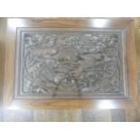 A 20th century oriental glass-topped teak Coffee Table, the centre carved and pierced with ducks and