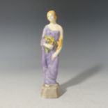 A Royal Doulton figure Autumn HN314, issued 1918-38, with black printed marks to base, H 19cm.