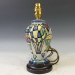 A Moorcroft 'Balloon' pattern Table Lamp, with tubelined decoration on blue ground, H 26cm.