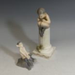A Royal Copenhagen figure of Pan, modelled on top of a column with a lizard to the side, model