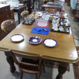 A late Victorian mahogany extending Dining Table, with two additional leaves, on bulbous legs and