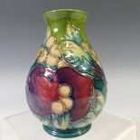 A Moorcroft 'Finch' pattern Baluster Vase, with tubelined decoration on green ground, factory