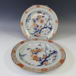 A pair of antique Japanese imari porcelain Chargers, decorated with flora and fauna within a