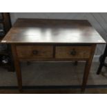 A 19th century oak Side Table, with two frieze drawers, on square tapering legs, top with splits,