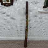 An Aboriginal didgeridoo, with applied coloured dot detailing of a lizard, 130cm long.