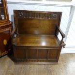 An antique style oak Monk's Bench, by Mark Rowe of Exeter, of typical box form, with makers label, W