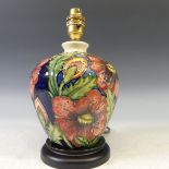 A Moorcroft 'Pheasants Eye' pattern Lamp Base, tubelined decoration on cream and blue ground, gilded