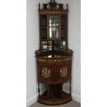 An Edwardian ivory inlaid rosewood bow-front standing Corner Cabinet, with mirrors, drawers,
