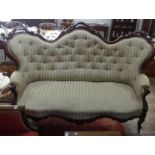 A Victorian mahogany framed three seater button back Sofa, of shaped and pierced serpentine form