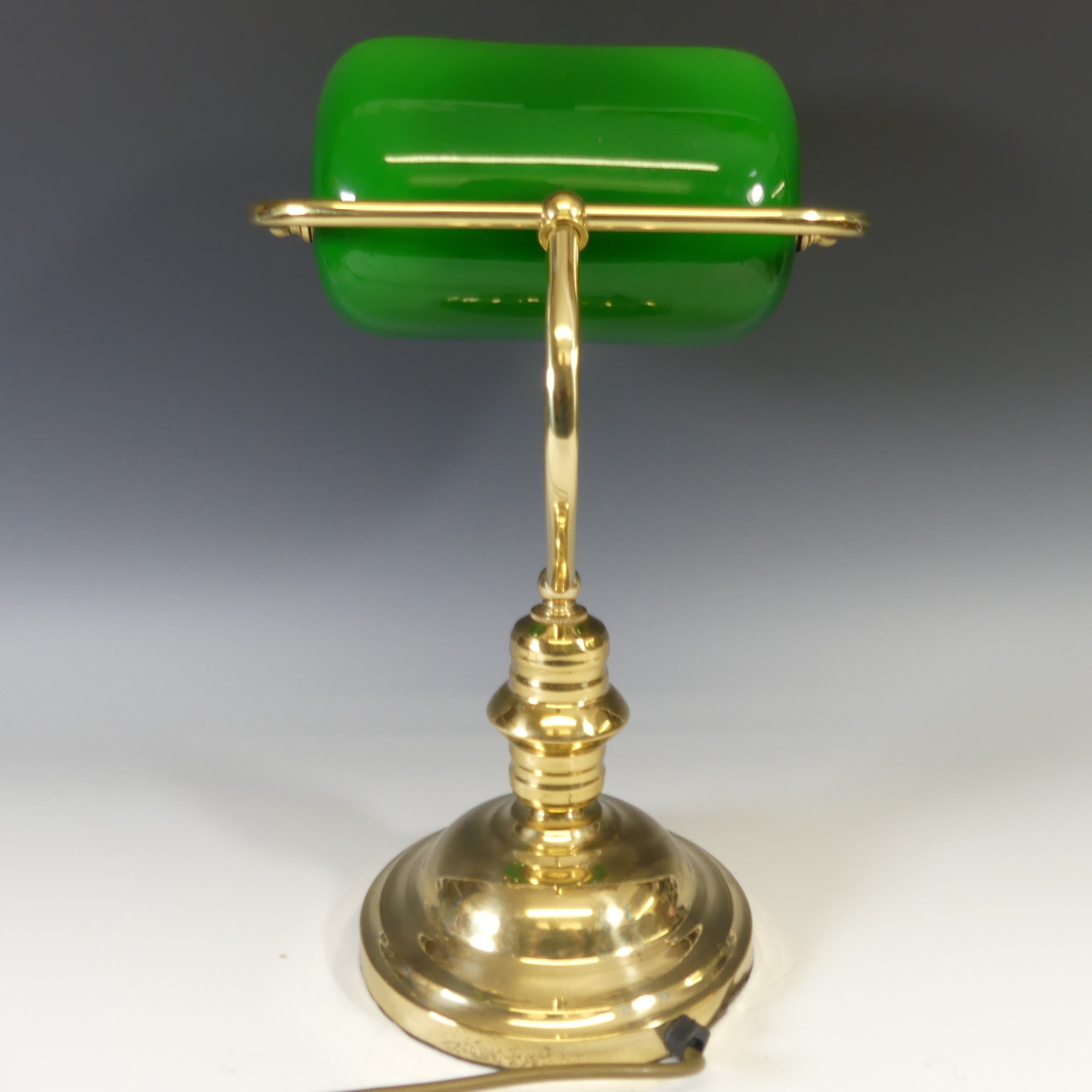 A vintage 20thC desk Lamp, having a brass base with green glass rectangular shade, H 37cm. - Image 2 of 2