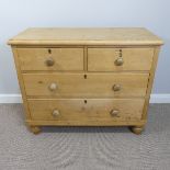 An antique pine Chest of Drawers, two short and two long drawers on bun feet, W:103cm x H:86cm x D: