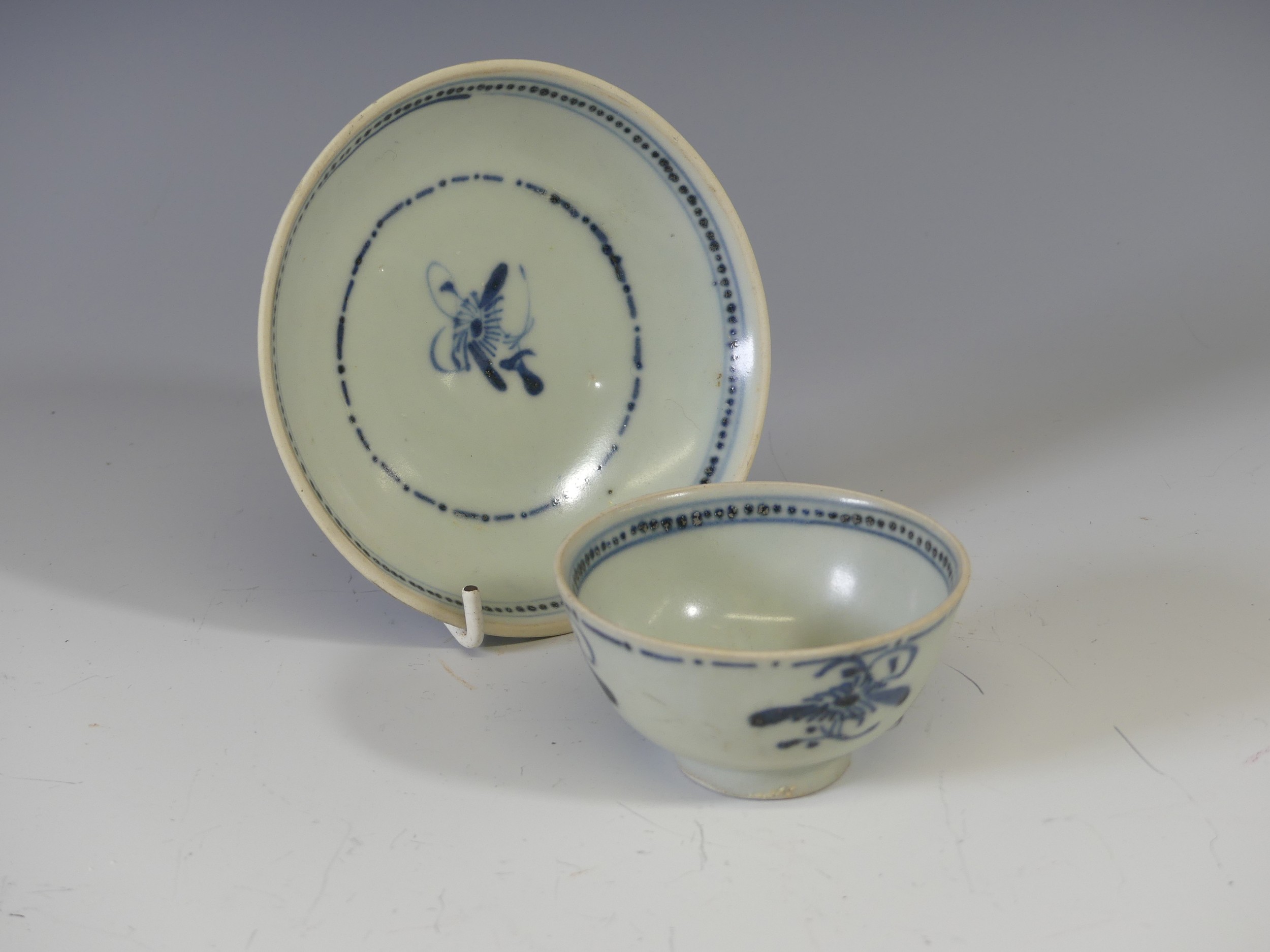 A Chinese Export 'Tek Sing Treasures' blue and white porcelain Tea Bowl and Saucer, decorated with a