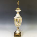 A 19thC gilt metal and milk glass Table Lamp, with gilt metal mounts and gilt floral decoration, H