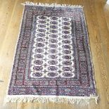 Tribal Rugs; a finely hand-knotted Bokhara rug, wool pile on cotton base, red and blue tekke and