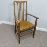 An Arts & Crafts oak slat back Elbow Chair, with leather seat, W 57cm x H 106cm x D 52cm.