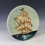 A Moorcroft limited edition 'Galleon' pattern Charger, tubelined decoration on blue ground,