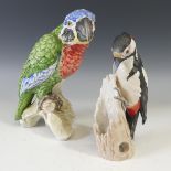 A Goebel porcelain figure of a Parrot, modelled perched on a stump, factory marks to base, H 21cm,