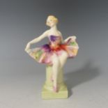 A Royal Doulton figure Columbine HN1439, designed by Leslie Harradine, issued 1930-40, green printed