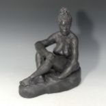 A studio pottery female nude by Paul Redvers, ex Honiton pottery, depicting a lounging female,