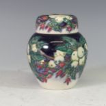 A Moorcroft 'Snowberry' pattern Ginger Jar, with tube lined decoration on cream/ blue ground, with