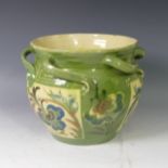 A C H Brannam pottery Jardiniere, of shouldered ovoid form with applied scroll handles, painted with