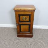 An Aesthetic Movement mahogany Pot Cupboard, the door with two ebonised, fielded panels, painted