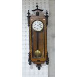 An early 20th century walnut Vienna regulator style wall Clock, the 8-day single weight movement