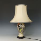 A Moorcroft floral Table Lamp and Shade, tube lined floral decoration on blue and cream ground, with