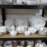 A Wedgwood 'Mirabelle' part Dinner and Tea Service, comprising Teapot, Sugar Bowl, Milk Jug, Cake