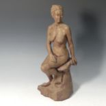 A Studio pottery female nude 'Sara' by Paul Redvers, ex Honiton pottery, depicting a woman seated on