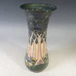 A Moorcroft 'Cluny' pattern Vase, designed by Sally Tuffin, tubelined decoration on a salmon pink