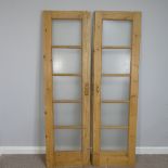 A pair of vintage pine five-panel glazed internal doors, with dimpled glass, each door 55cm wide x