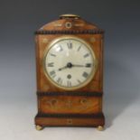 A small Regency mahogany Bracket Clock, with circular white dial and black Roman numerals, a