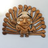 An Aztec-style copper wall Plaque/Mask, in the form of a warrior,