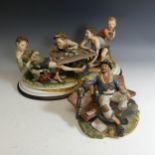 A Capodimonte porcelain Figural Group of boys playing cards, marked Bruno Merli, raised on an oval
