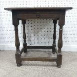 A 18th century oak Side Table, the associated top with cleated ends, above a frieze drawer on turned