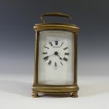 A French gilt brass Carriage Clock, of bow-front five-glass form, the dial marked "Finnigan" and "