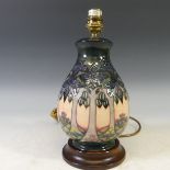 A Moorcroft 'Cluny' pattern Lamp Base, with tubelined decoration on salmon pink ground, H 28cm.