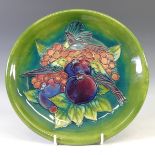 A Moorcroft 'Finch' pattern Plate, with tubelined decoration on green ground, factory marks to base,