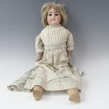 An Armand Marseille bisque shoulder head doll,  with fixed brown glass eyes, open mouth, with top