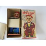 A Vintage Tinplate Smoking McGregor Toy, in super condition, by Rosko Toys Japan.  In original