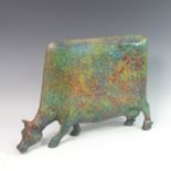 Lawson E. Rudge (b. 1936), a raku fired studio pottery sculpture of a Grazing Cow, with mottled
