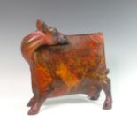 Lawson E. Rudge (b. 1936), a bronze sculpture of a Cow, with red and orange metallic finish, H 37cm.