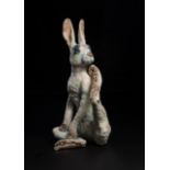 Lawson E. Rudge (b. 1936), a raku fired studio pottery sculpture of a Hare, modelled scratching, H