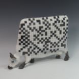 Lawson E. Rudge (b. 1936), a raku fired studio pottery sculpture of a Cow, with chess board design