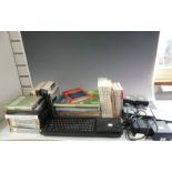 A vintage Sinclair computer QL, with power unit, dust cover, 16 assorted QL books, together with a