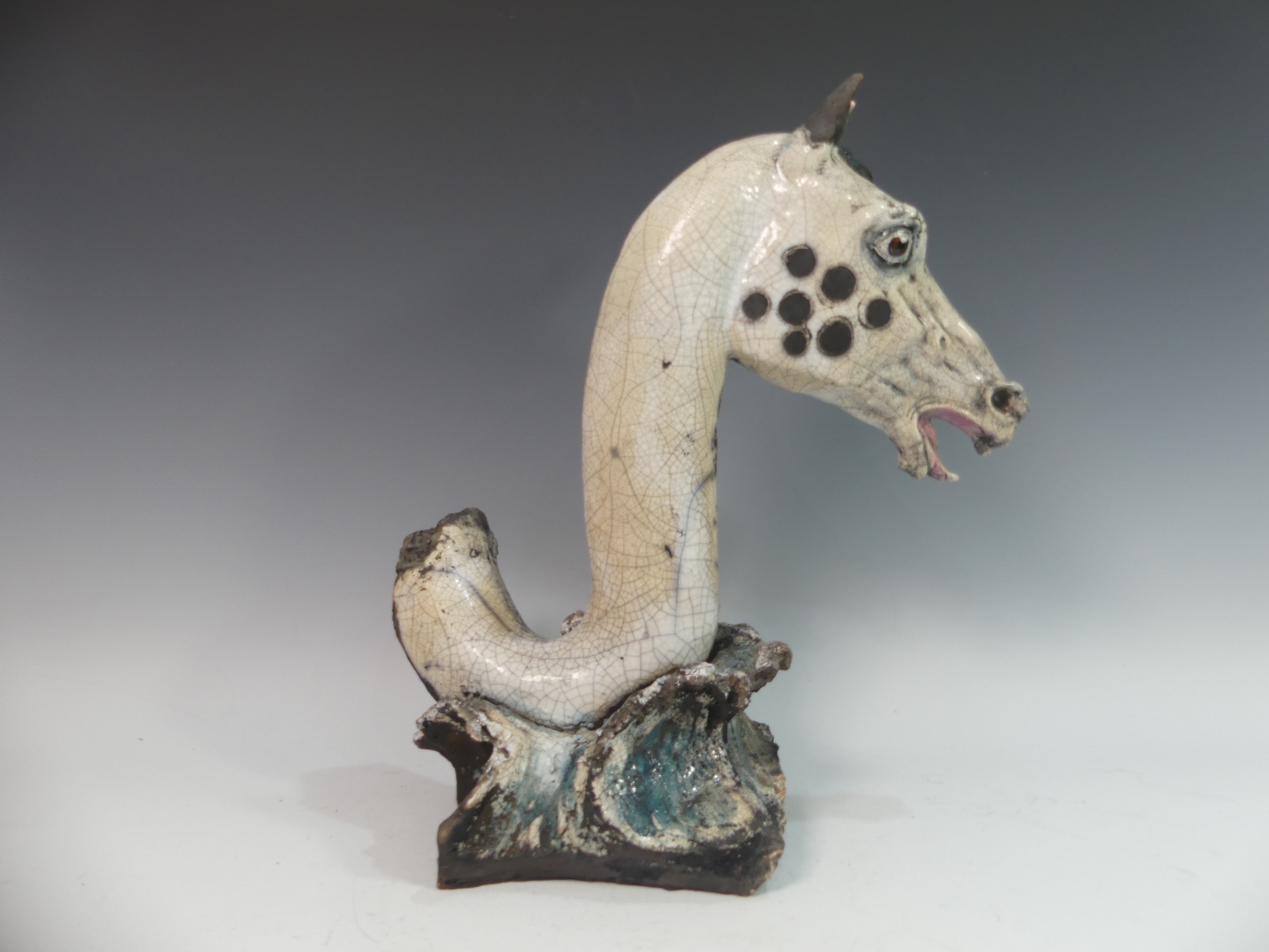 Lawson E. Rudge (b. 1936), a raku fired studio pottery sculpture of a Horse Head, modelled on a