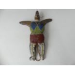 A 19thC Folk Art carved pine and polychrome decorated Jumping Jack Toy, in the form of a